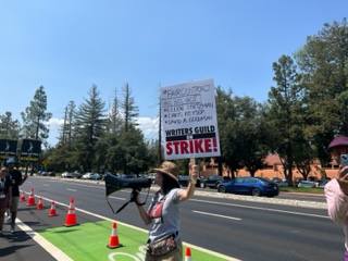 WGA worker rallied at Netflix world headquarters in Los Gatos to demand protection from AI and the war on workers in this industry by the billionaires ...