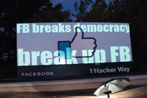 Protesters Hijack Giant "Like" Sign at Facebook Headquarters