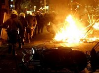 The riot police headquarters in Zografou, Athens were attacked earlier today, with one riot police van and a few cars burnt.nnIndymedia reports that the state-run TV station NET was occupied for a f