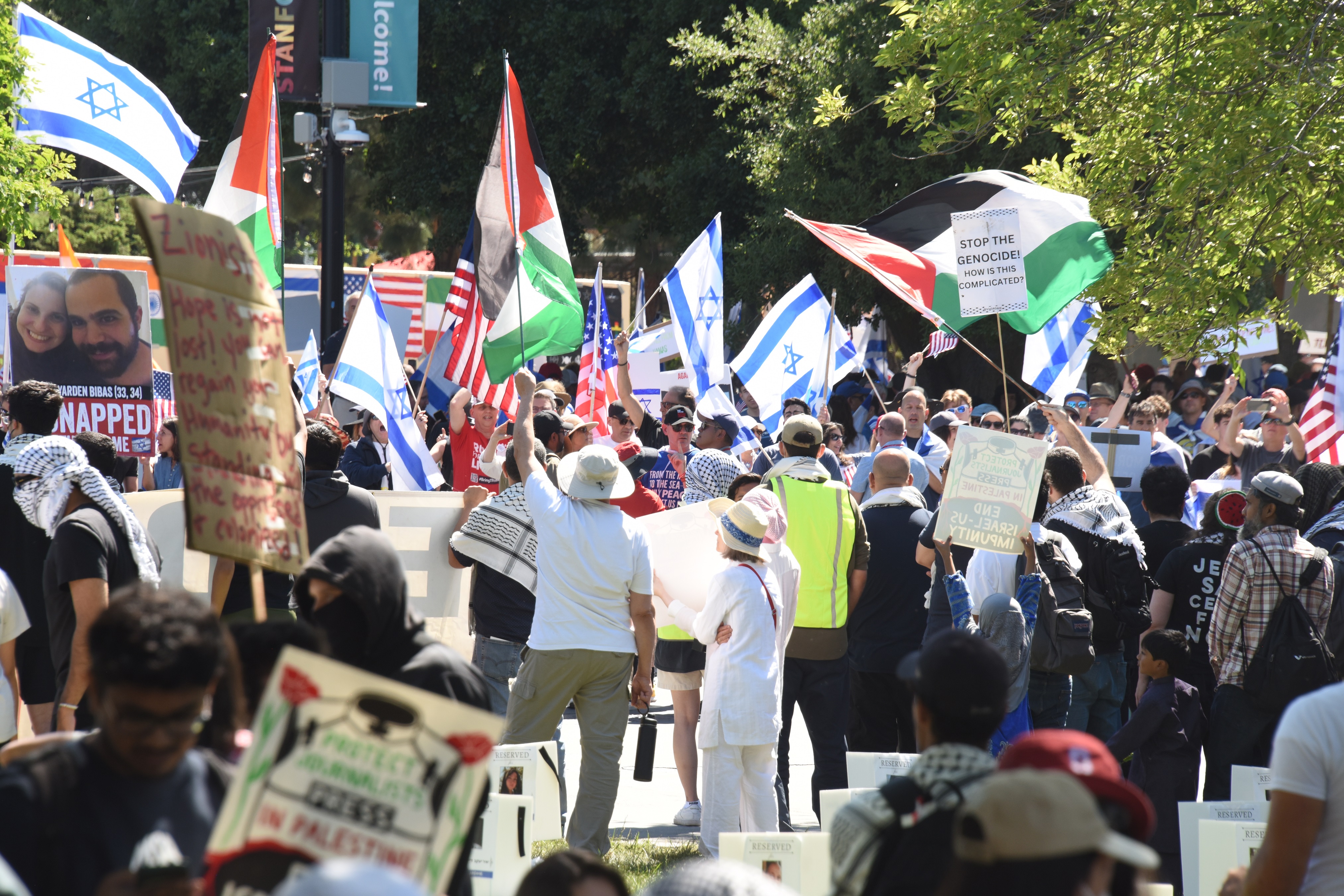 Israeli flags next to Palestinian flags