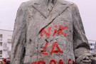 "NIK LA FRANCE" has been spraypainted, in red, on a statue of Charles de Gaulle.