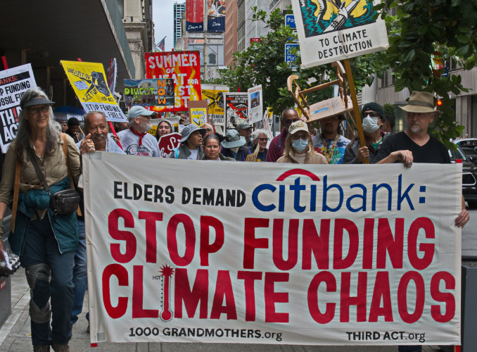 Elders bring their rocking chairs  for sit-in protest at Citibank, the largest fossil fuel investor