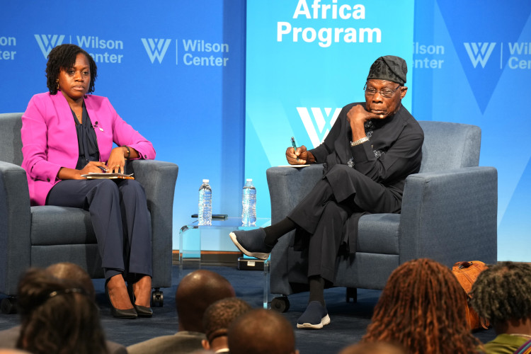 Oge Onubogu, Wilson Center, Africa Programs director in concerastion with Former Nigerian President Obasanjo. 