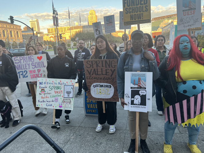 Teachers At Rally With Placards