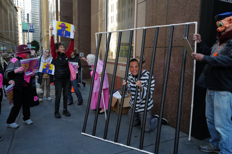 Anti-war activists protested outside of Senator Alex Padilla's office in San Francisco calling on him to "Stop Funding Genocide" with a m...