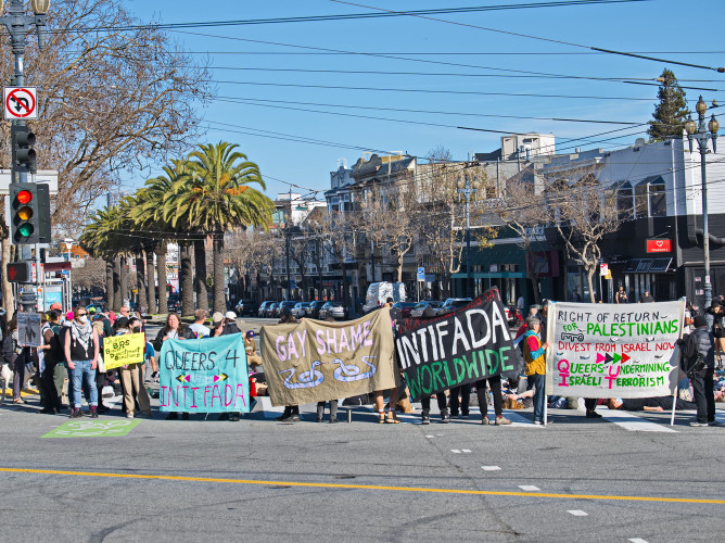 Rally by QUIT (Queers Undermining Israeli Terrorism) pickets Chevron station and hold die-in on Market Street