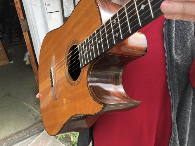 Photo of my D.E.I., handmade international acoustic steel-string guitar.
