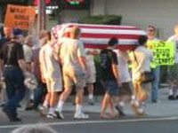 symbolic flag-draped casket